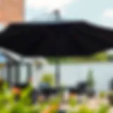 Elegant black patio umbrella providing shade in a stylish outdoor setting